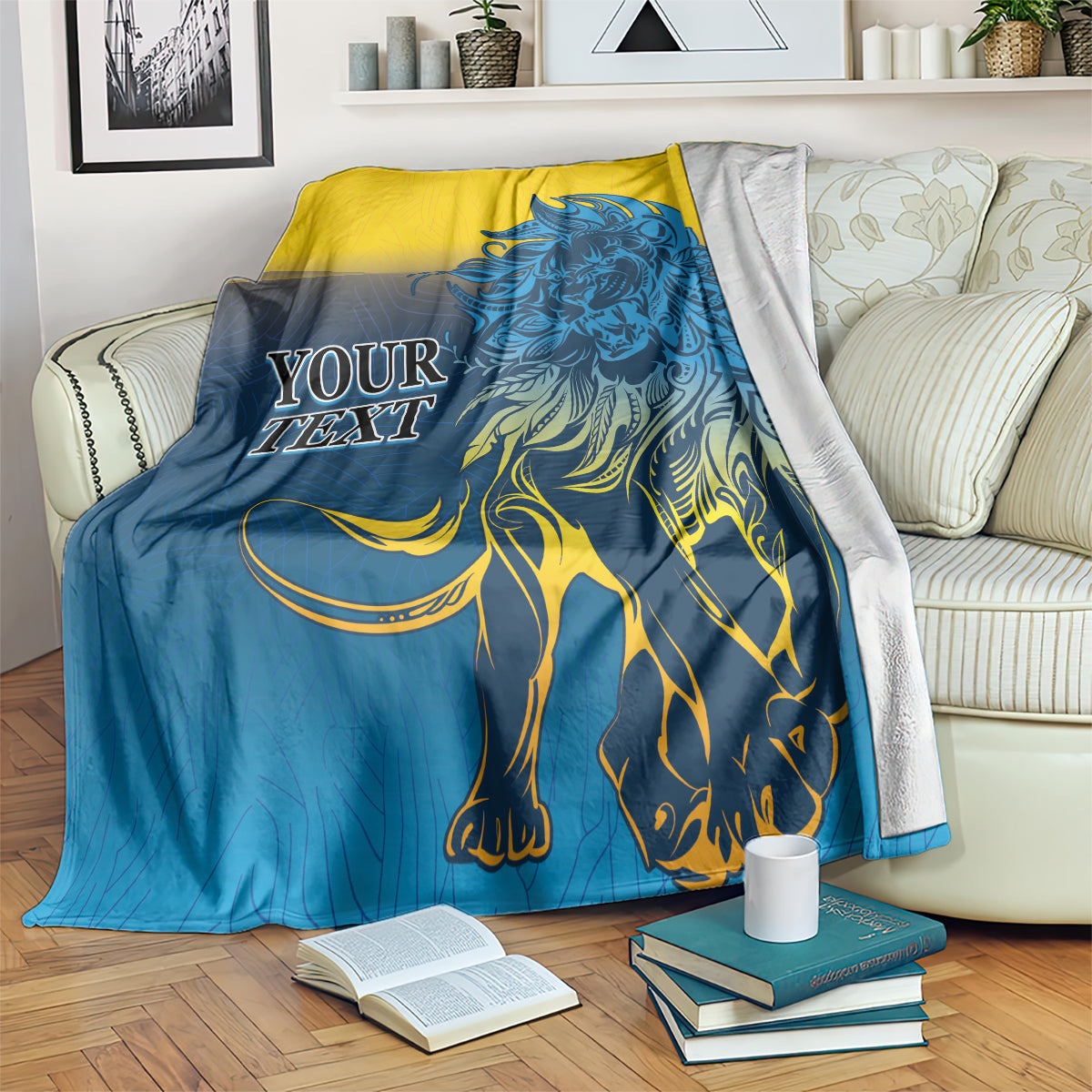 Lion print blanket in blue and yellow, draped over a bed with detailed lion artwork