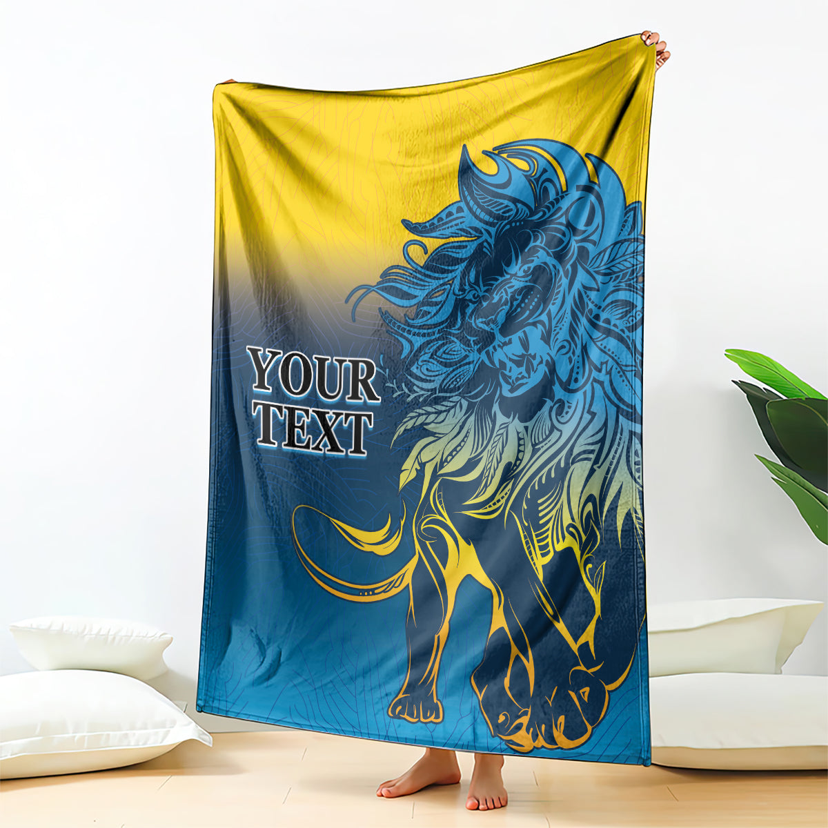 Lion print blanket in blue and yellow, draped with a large roaring lion design