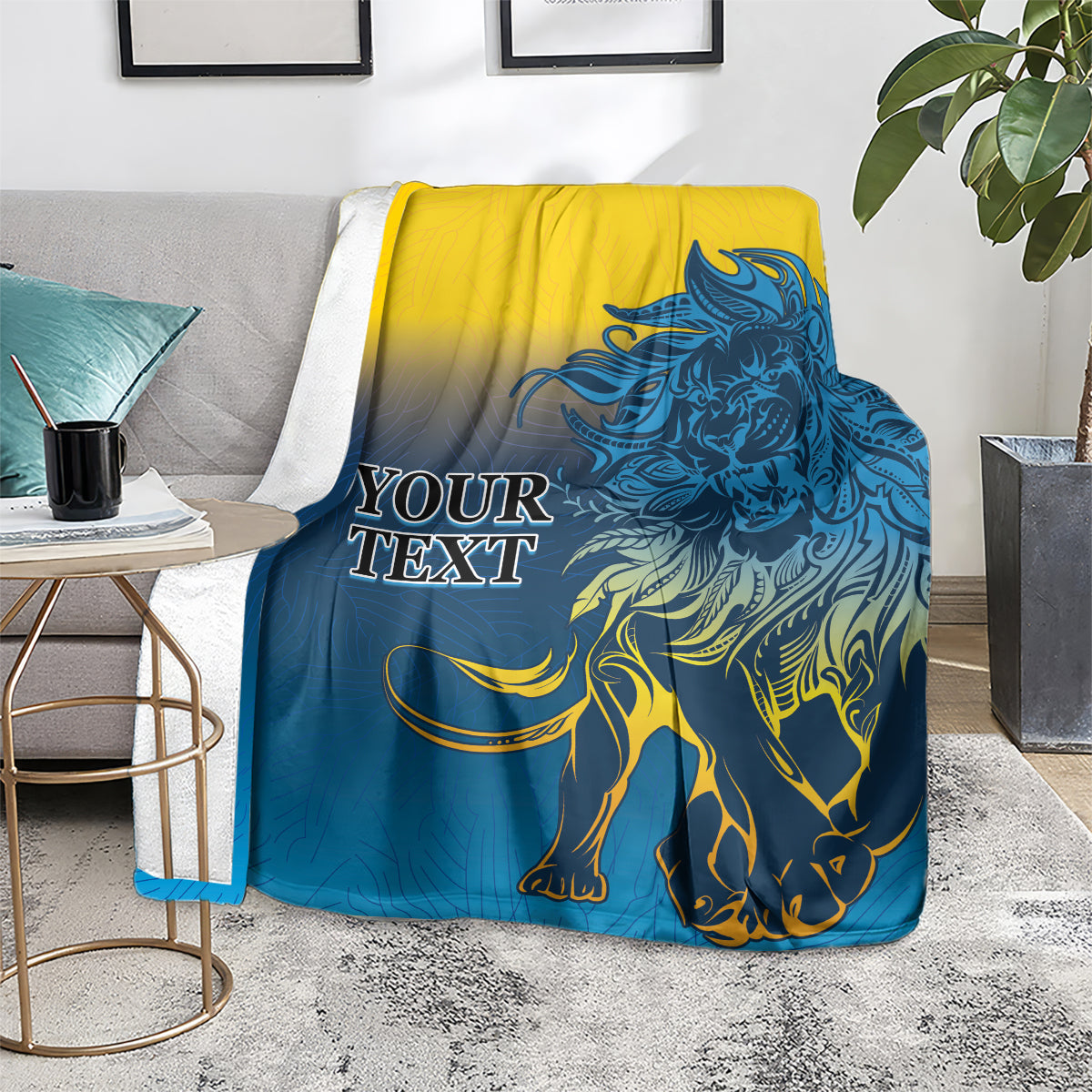 Lion print blanket in blue and yellow, draped over a couch with lion and mane design