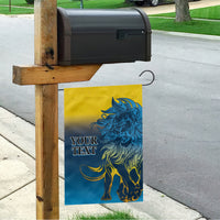 Yellow and blue lion graphic garden flag on a wooden pole with hanging design
