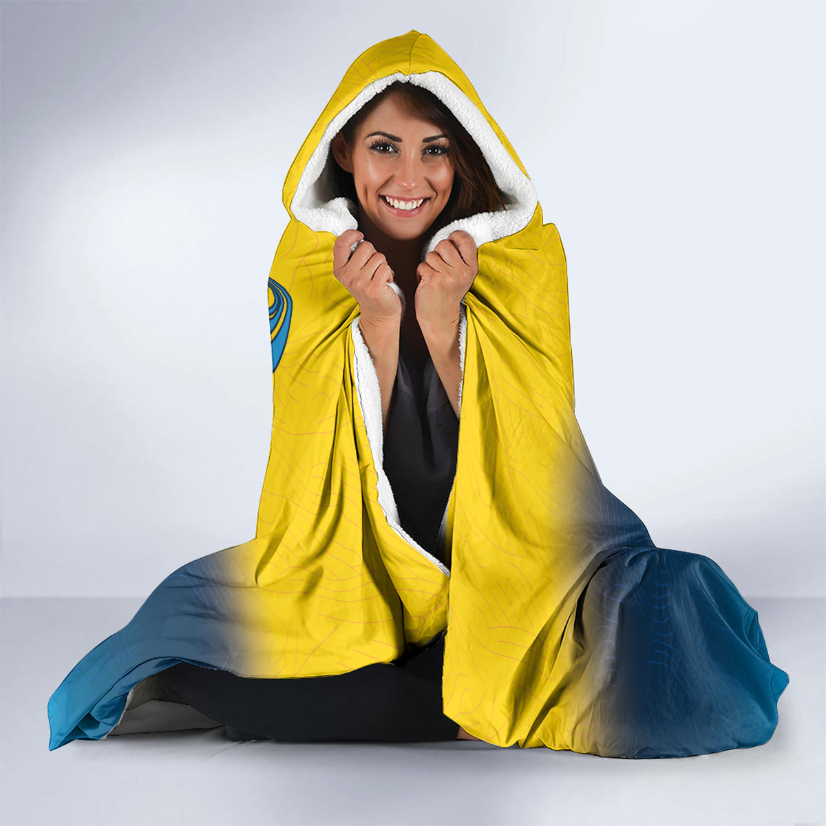 Hooded blanket with yellow hood and white sherpa trim, blue cape bottom