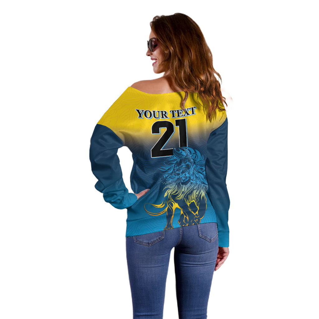 Off-shoulder sweater back view with lion graphic and number 21, blue and yellow