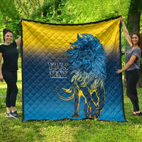 Quilt blanket with blue-and-yellow diamond quilting and a blue lion graphic, “YOUR TEXT”