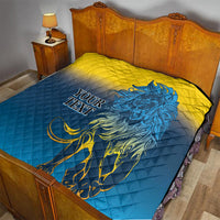 Quilt blanket on a bed with blue-and-yellow diamond pattern and blue lion art, “YOUR TEXT”