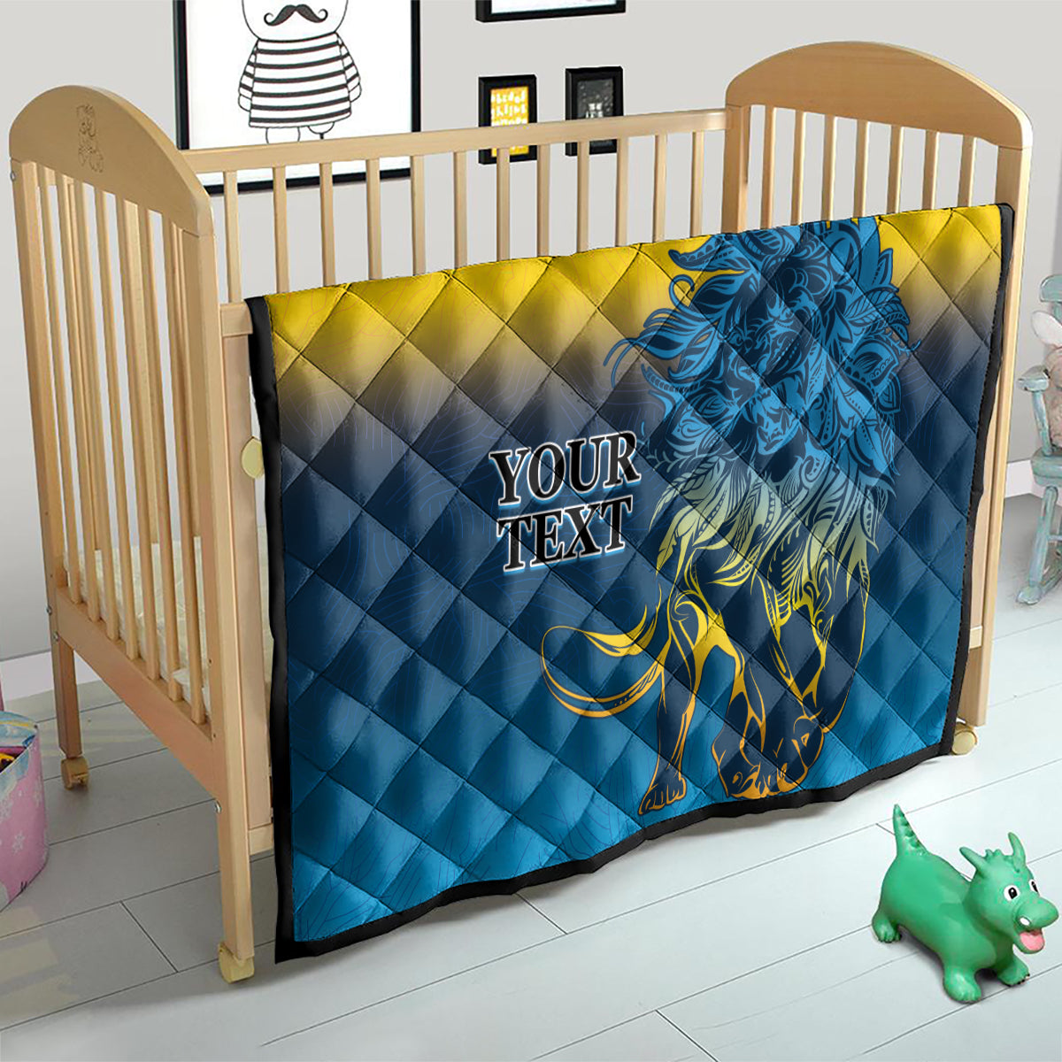 Baby quilt blanket with blue-and-yellow diamond quilting and blue lion graphic, “YOUR TEXT”