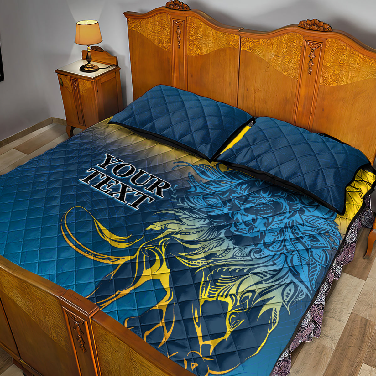 Blue quilt bed set with lion artwork, two square pillowcases, dark trim detail