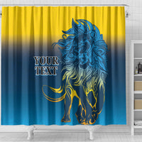 Shower curtain with blue lion graphic and yellow-to-blue gradient, front view
