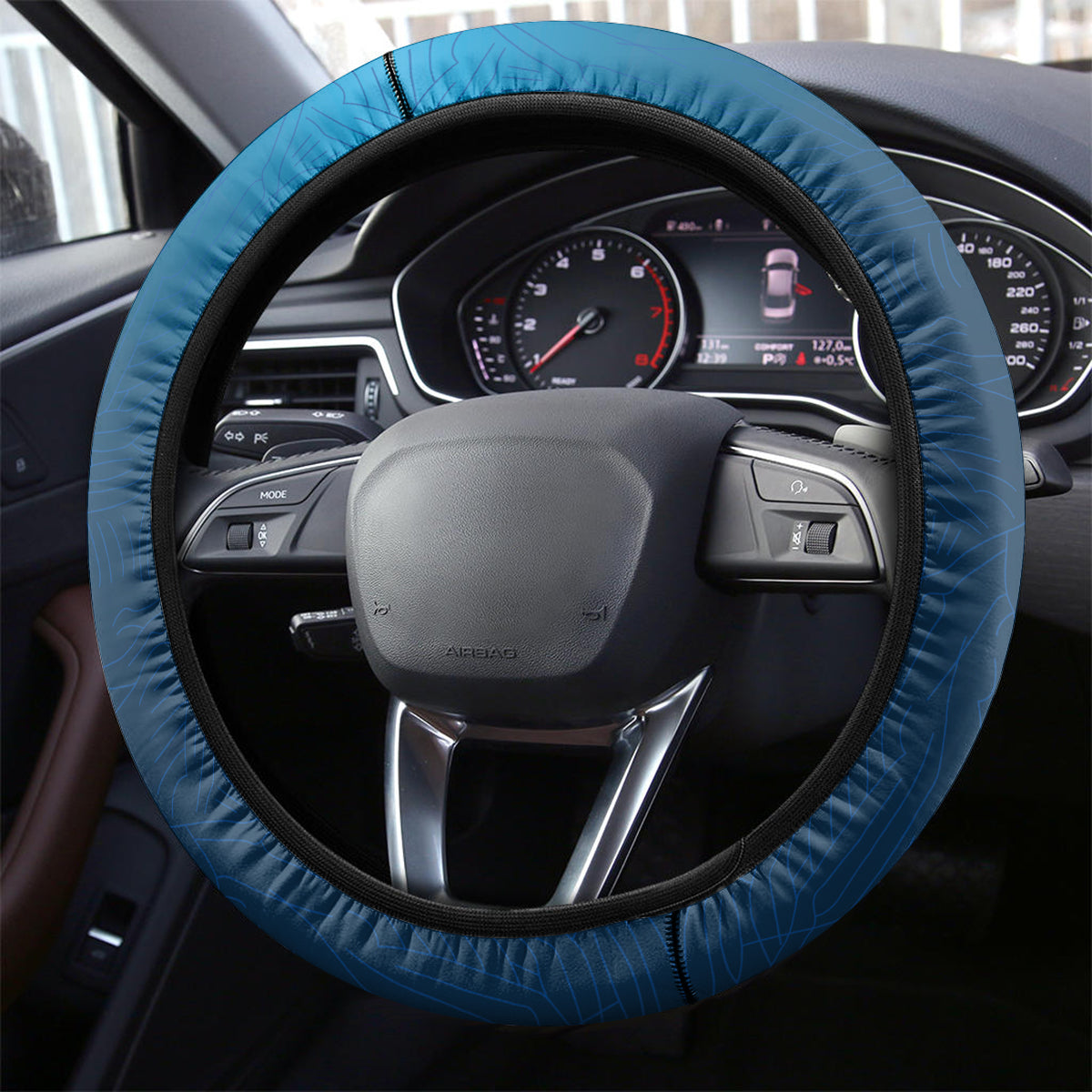 Blue steering wheel cover with black trim and textured grip edge