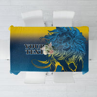 Blue tablecloth with bold lion graphic and yellow decorative accents, square shape