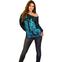 Women’s dark teal off-shoulder sweater with aqua graphic front and long sleeves