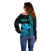 Women’s dark teal off-shoulder sweater, back view with 'YOUR TEXT' and aqua emblem