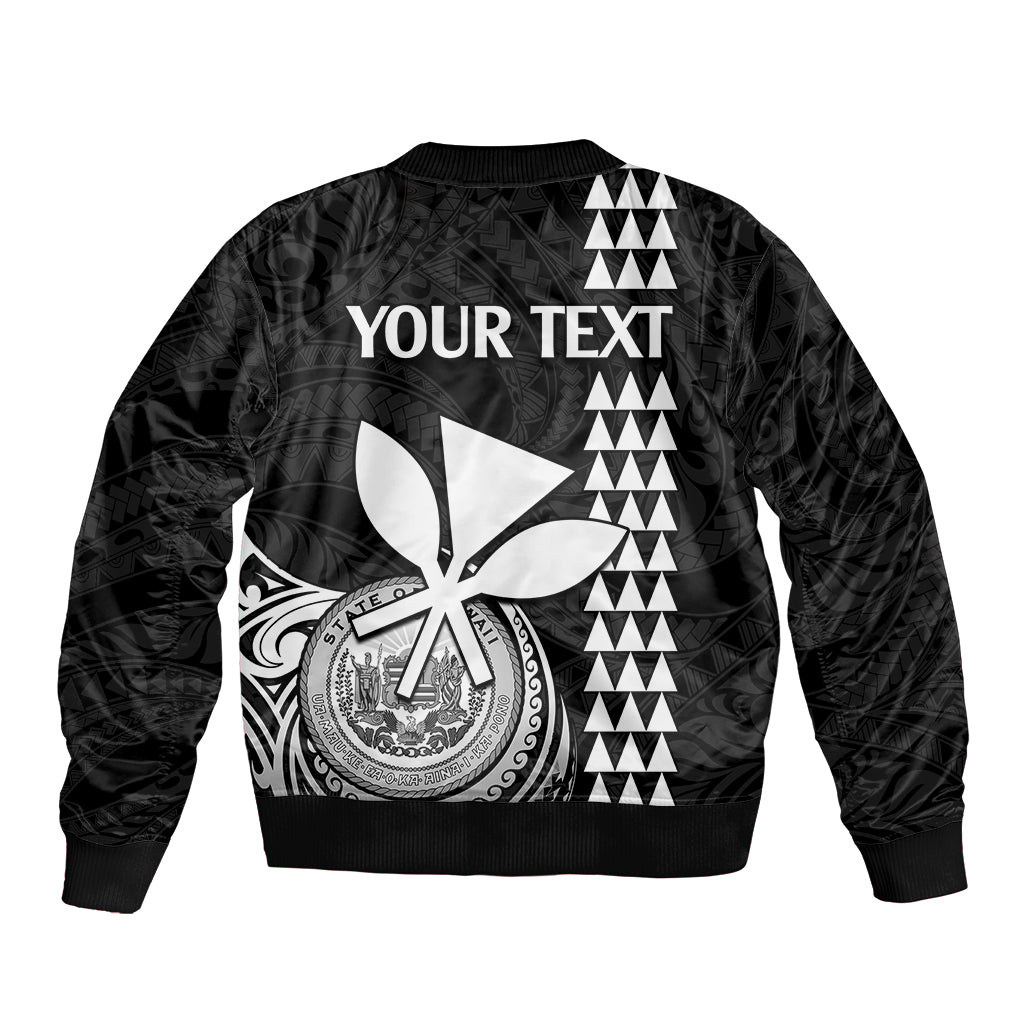 Black bomber jacket back with large scissor-and-emblem graphic and zigzag triangle stripes