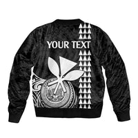 Black bomber jacket back with large scissor-and-emblem graphic and zigzag triangle stripes