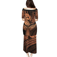 Back view fitted short-sleeve midi dress with black and gold Polynesian-style print