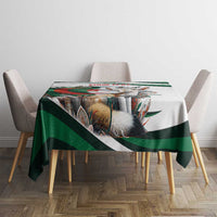 Personalized white tablecloth with green stripe border and fox artwork on small dining table
