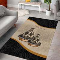 Rectangular area rug with beige center, black tribal bands, gold edge and tajine print