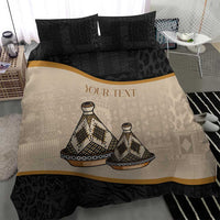 Bedding set duvet with beige tribal print, black patterned sides, and gold stripe.