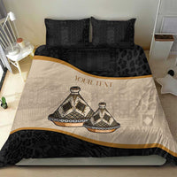 Bedding set duvet cover with beige and black tribal motifs, gold stripe, and two black pillows.