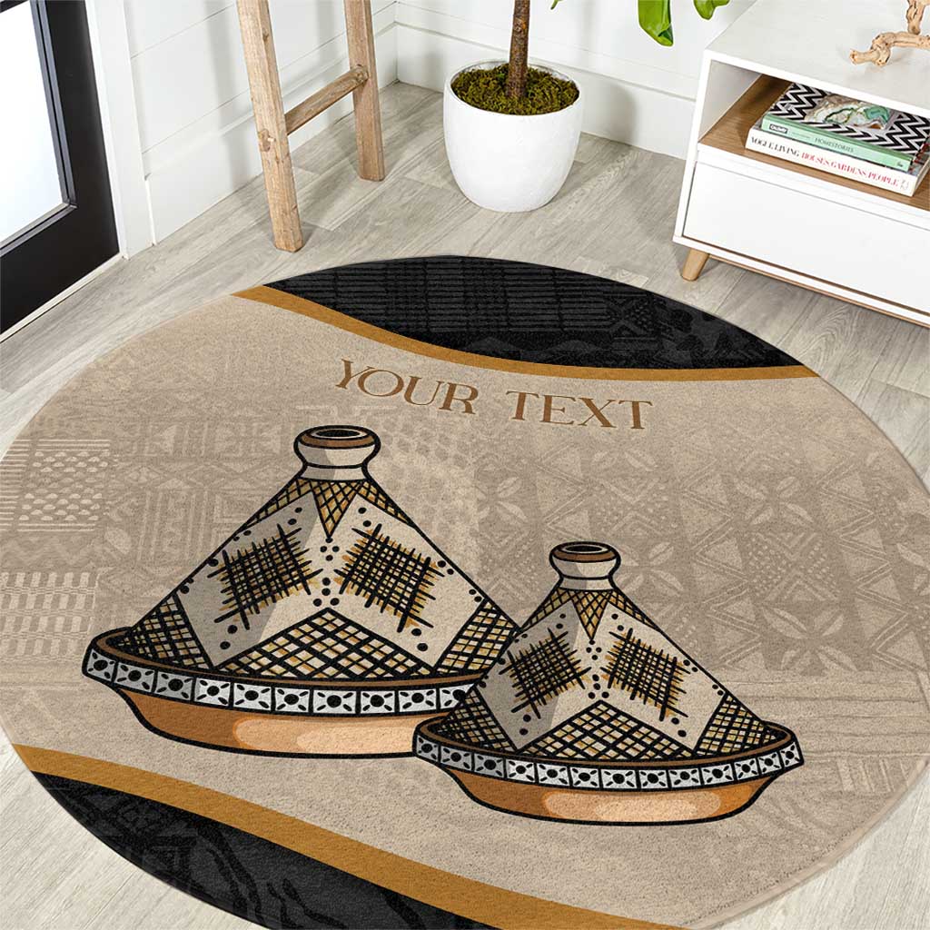 Round beige carpet with black border and large tajine dish tribal motif, gold 'YOUR TEXT'