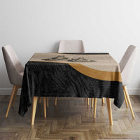 Black and beige tablecloth with gold band and intricate geometric tribal design