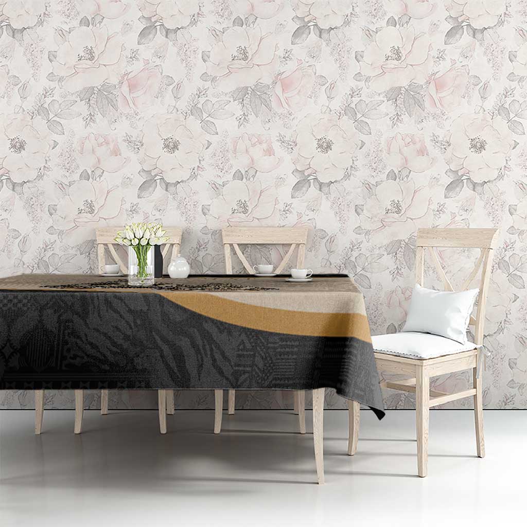 Black and beige Moroccan-style tablecloth with geometric tribal pattern and gold stripe