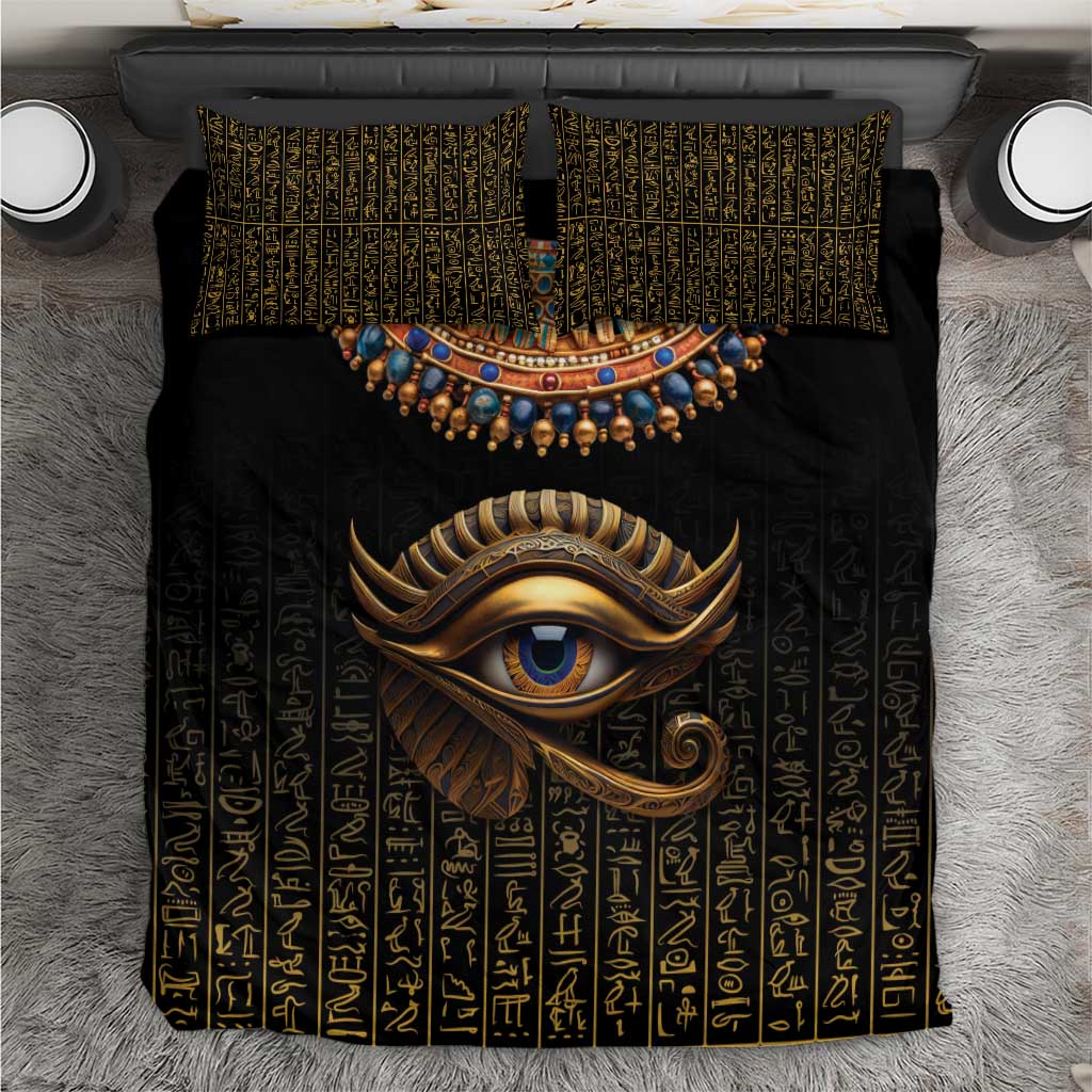Black duvet top with gold Eye of Horus face and Egyptian hieroglyph striping, square pillows