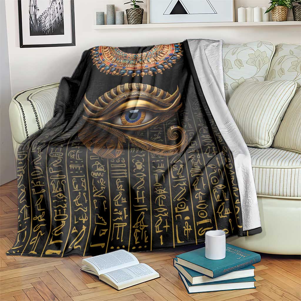 Black Egyptian-style blanket with Eye of Horus and gold hieroglyph pattern