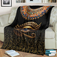 Black Egyptian-style blanket showing Eye of Horus and gold hieroglyph pattern
