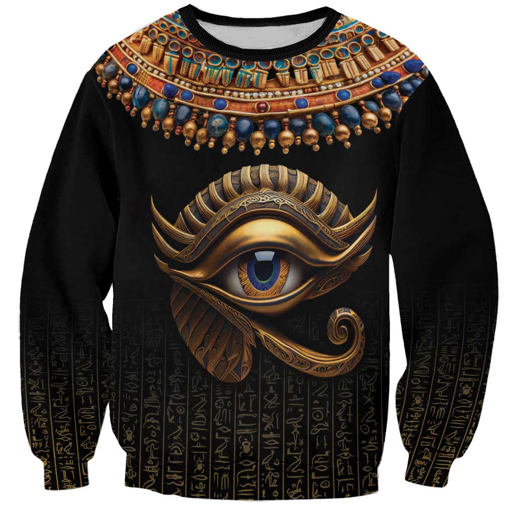 Black unisex sweatshirt with gold-blue Eye of Horus print and rows of hieroglyphs