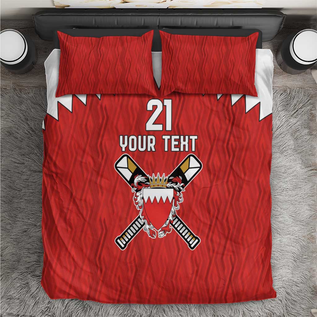 Red bedding set with two pillow covers and cricket crest graphic on duvet