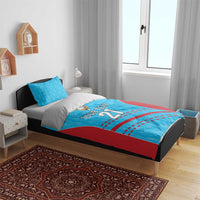 Cricket bedding set on a bed: blue patterned duvet with red accents, 'YOUR TEXT 21' center print