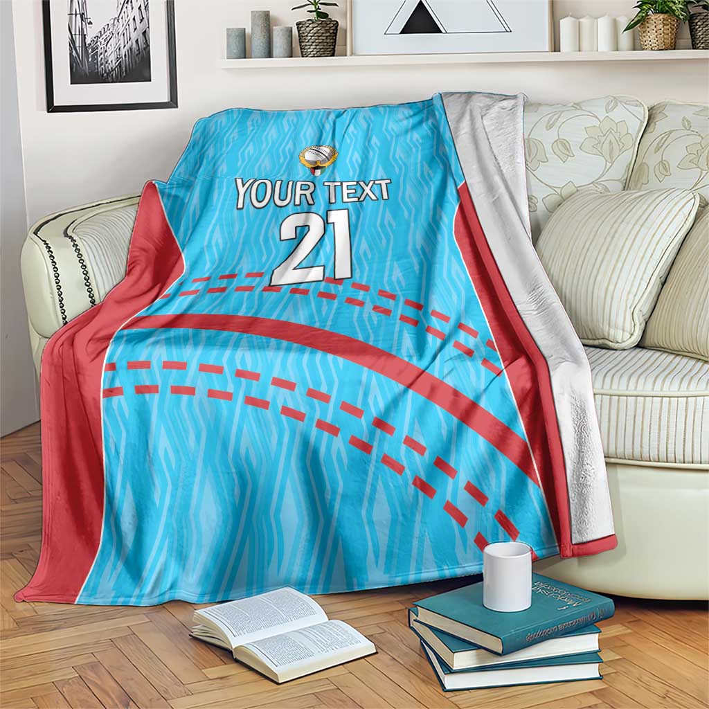 Blue cricket blanket with red trim, zigzag pattern, crest, 'YOUR TEXT' and '21'
