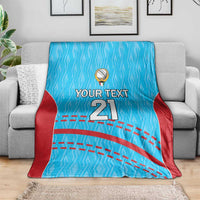 Blue blanket with red side panels, crest icon, 'YOUR TEXT' and '21' zigzag print