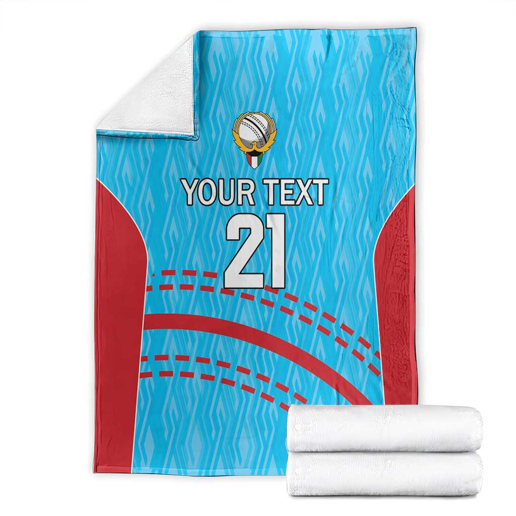 Folded blue cricket blanket with red panels, crest, 'YOUR TEXT' and '21' print