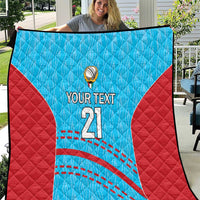 Blue and red cricket quilt showing 'YOUR TEXT 21' with ball emblem and stitched arcs.