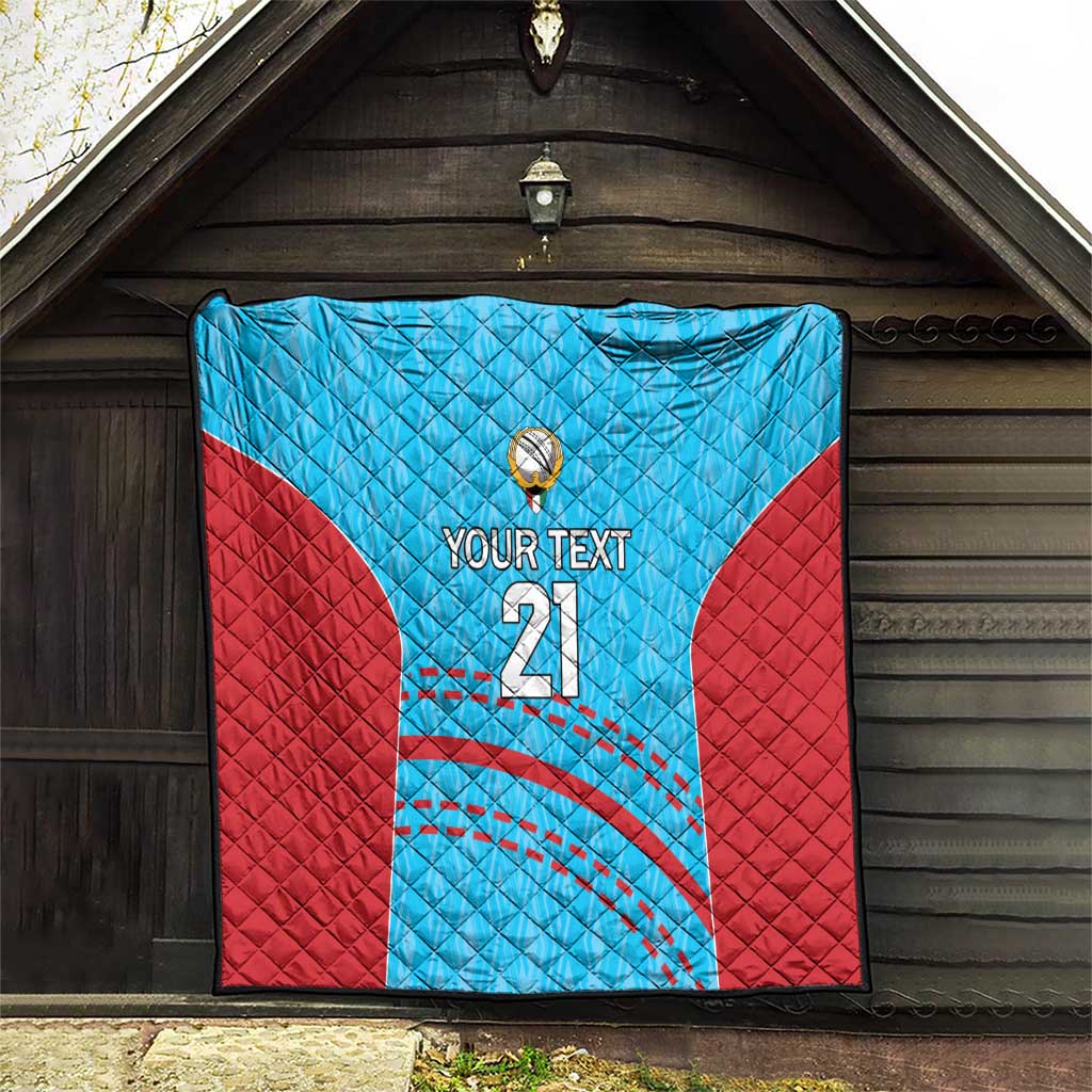 Blue and red cricket quilt with 'YOUR TEXT 21' and stitched ball emblem, hanging display.