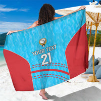 Blue and red cricket-pattern sarong with 'YOUR TEXT 21' front print, draped over shoulders