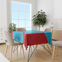 Blue and red cricket-themed tablecloth draped over a dining table with patterned border