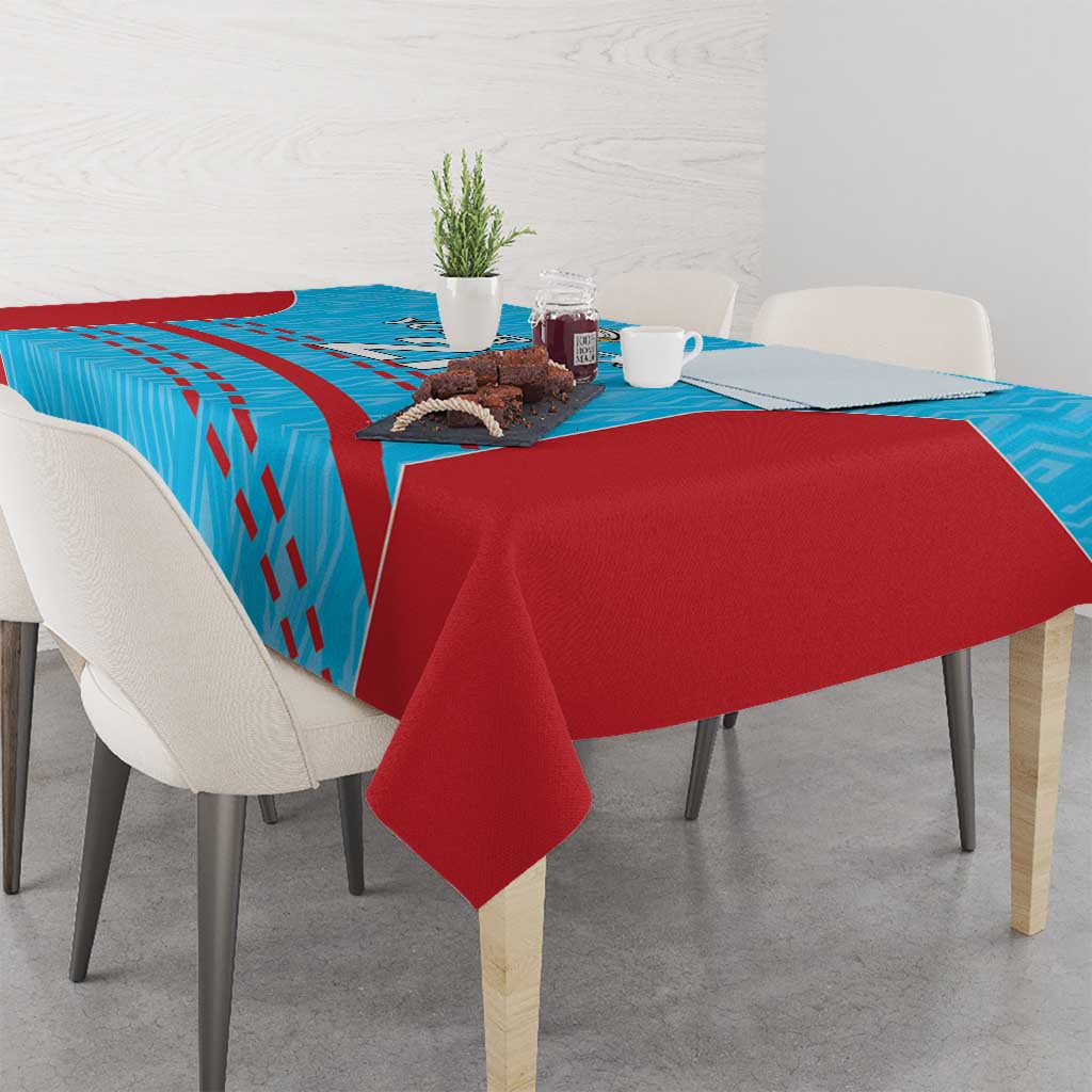 Cricket tablecloth with blue patterned center and solid red table skirt with folded drape