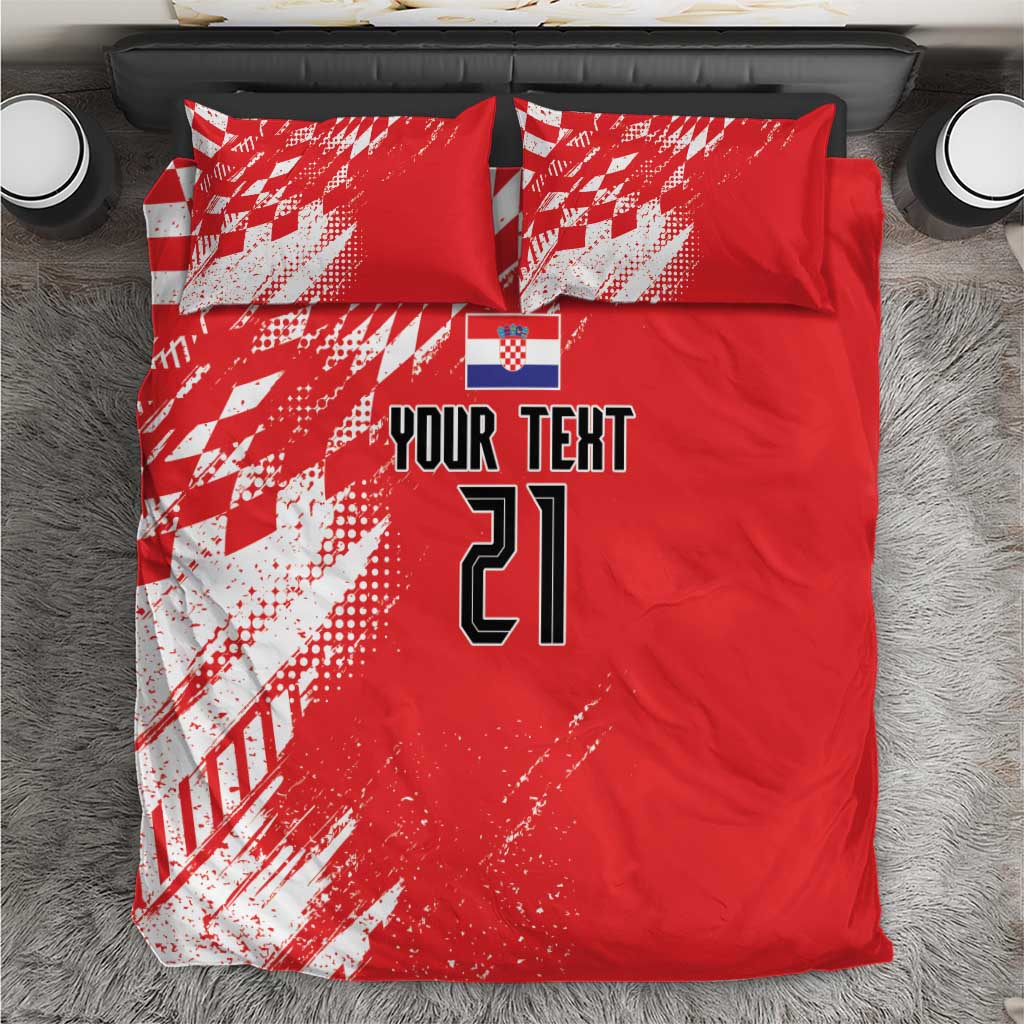 Red bedding set with white sporty graphic pattern, custom text, and number 21 on duvet and pillows