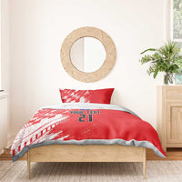 Red duvet cover bedding set with white sporty pattern, custom text, and number 21; one pillow visible