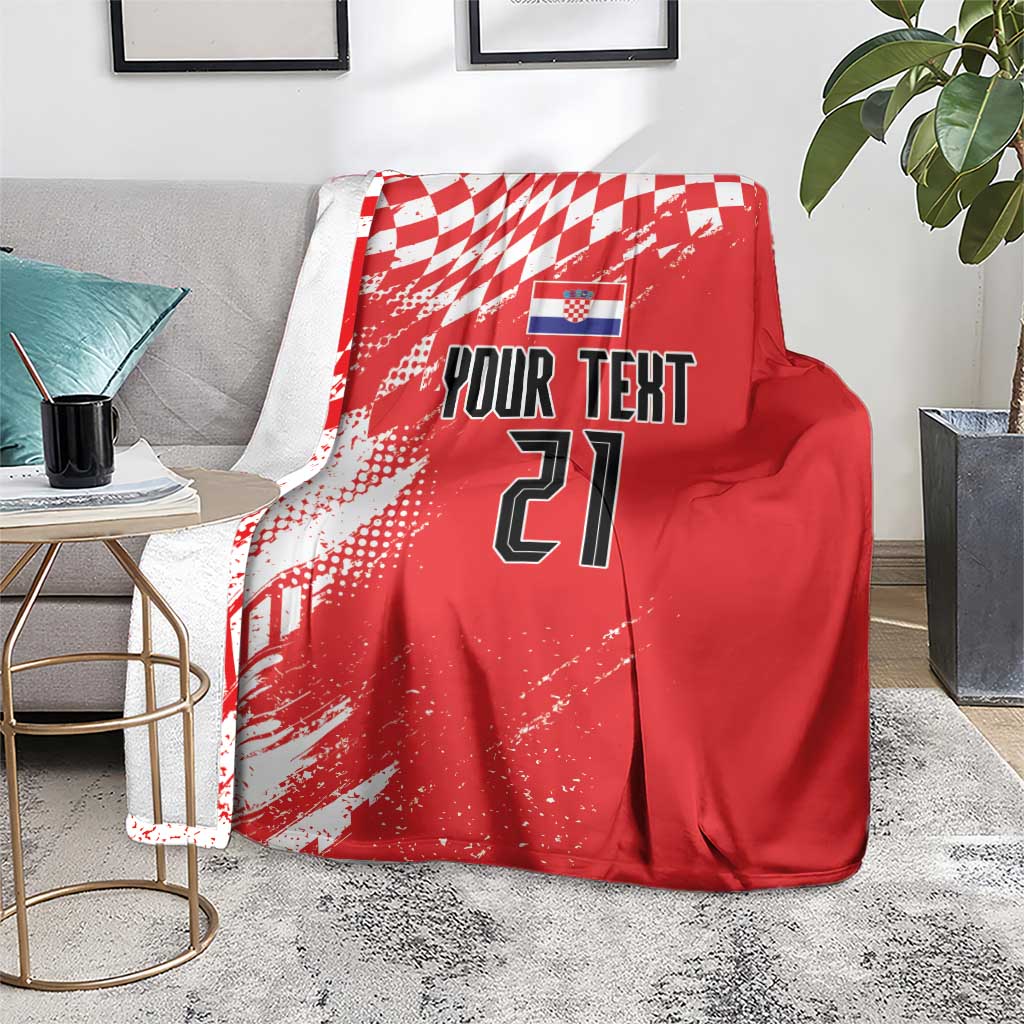 Red custom rugby blanket on gray couch, white check pattern with “Your Text” and 21
