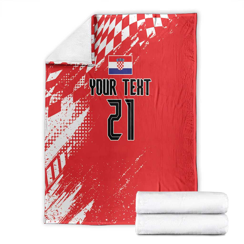 Red custom rugby blanket folded with white check pattern, “Your Text” and number 21