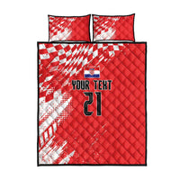 Red and white quilt bed set with sporty chessboard pattern, two pillowcases, black edging