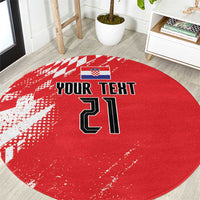 Red round rug with checkered sporty pattern and large custom-style numbers