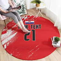 Red round rug with sporty checkered pattern and bold black-and-white number design