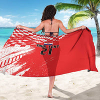 Red and white checkered rugby sarong draped wide with 'YOUR TEXT 21' centered