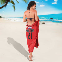 Red sarong with 'YOUR TEXT 21' text on the front and checkered accent hem