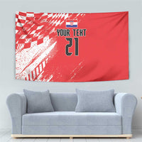 Red tapestry with sporty diagonal pattern, shield icon, and custom number design