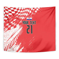 Red rectangular tapestry wall hanging with sporty check pattern, shield icon, and number